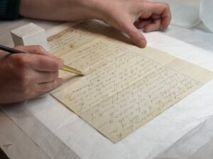 Mending historical documents with Japanese tissue.